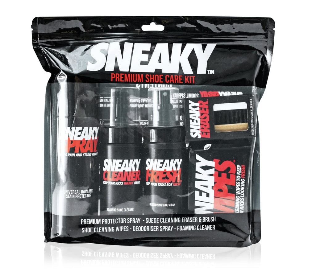 The image features the Sneaky Complete Shoe Cleaning Kit, packaged in transparent wrapping. This all-inclusive kit provides shoe cleaner, a Sneaky Spray Protector, freshener, wipes, and a cleaning eraser with brush—all prominently displaying the Sneaky brand logo.