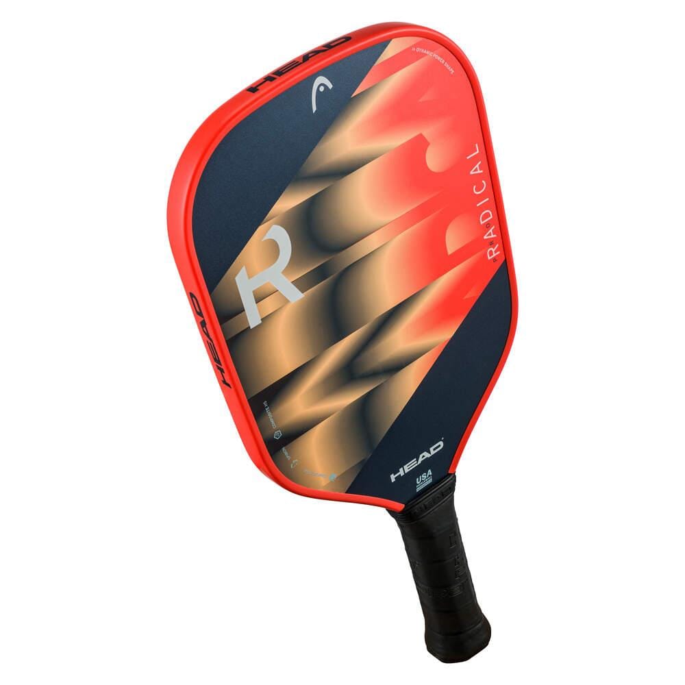 The HEAD Radical Pro Pickleball Paddle features a black and orange face with a bold “R” design, a black grip-wrapped handle, and a composite surface for enhanced spin technology.