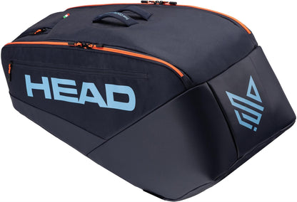 The HEAD Pro 9 Racket Tennis Bag L - Navy by HEAD is a large, dark blue bag with a light blue logo and orange zippers, perfect for carrying tennis gear or ski boots like Jannik Sinner. Shown on a white background.