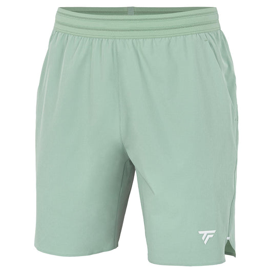 Tecnifibre Team Stretch Men's Tennis Shorts in sage green feature an elastic waistband and a small white logo on the lower left leg. These shorts offer a sleek, clean design and are set against a white background.