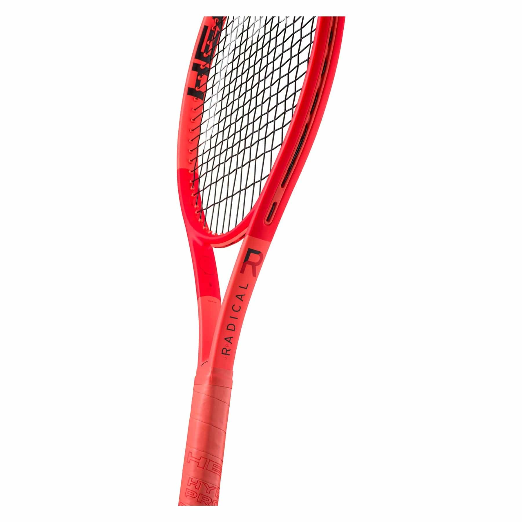Close-up of the bright red HEAD Radical Junior 2025 Tennis Racket by HEAD, featuring "RADICAL" on the shaft and showcasing its strings and handle. Highlights Auxetic 2.0 technology against a clean white background.