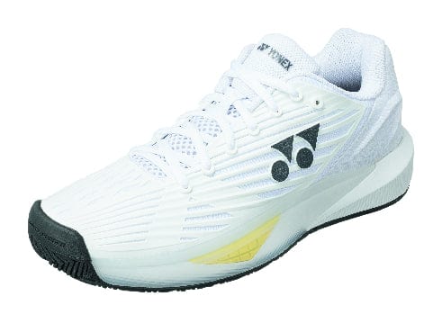 The Yonex Power Cushion Eclipsion 5 Men's Tennis Shoes - White feature a sleek and modern design, showcasing a textured white surface with a striking black logo and sole. The vibrant yellow midsole accent adds flair, complemented by white laces to ensure both style and performance on the courts.