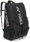 The Yonex BA726212EX Gearlogic 12 Racket Tennis Bag in black has three zippered compartments, sturdy shoulder straps, and a white Yonex logo—ideal for carrying sports gear or as a compact tennis bag.