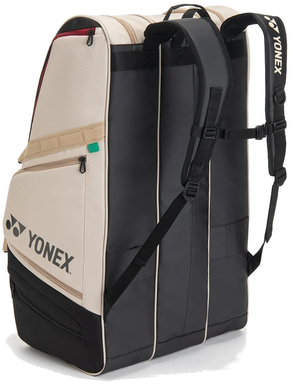 The Yonex BA726212EX Gearlogic 12 Racket Tennis Bag in beige features multiple compartments, shoulder straps, a side pocket, self-standing design, and prominent Yonex branding. Holds up to 12 rackets for ultimate convenience.