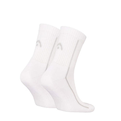 A pair of HEAD Performance Short Crew Tennis Socks in white, featuring a subtle gray logo, displayed on a plain background. They showcase ribbed texture, crew length style, and excellent breathability.