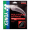The Yonex Polytour Strike Tennis String packaging features an elegant iron grey design, emphasizing its robust polyester construction tailored for competitive players. With a thickness of 1.25mm and a length of 12m/39 feet, these strings promise lasting performance.