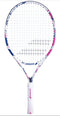 The Babolat B-Fly 23 Junior Tennis Racket showcases a blue and pink pattern on its white frame and strings, with the brand name "Babolat" prominently displayed on both the shaft and head. The racket features a white grip highlighted with pink accents, designed for beginners, and is set against a plain white background.