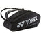 The Yonex 92429EX 9 Racket Pro Tennis Bag in black, designed by Yonex, offers multiple compartments and durable YKK zippers. It features shoulder straps along with the Yonex logo and "Pro Performance" text in white. Its Thermo Guard lining guarantees optimal protection for your gear.