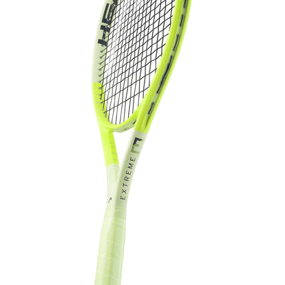 The HEAD Extreme Team 2024 Tennis Racket - Green features a vibrant neon yellow design with contrasting black strings and the word "EXTREME" prominently displayed on the frame. Equipped with Auxetic 2.0 technology and spin grommets, this racket delivers outstanding power and precision. The handle is wrapped in coordinating neon yellow for a sleek look.