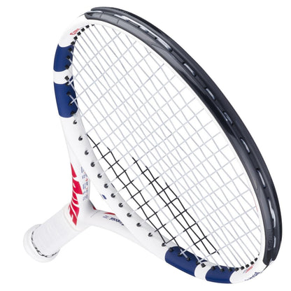 A close-up of the Babolat Drive Junior 24 Tennis Racket by Babolat, featuring blue and red accents on its rounded frame and strings against a white background—an ideal tennis racket for kids.