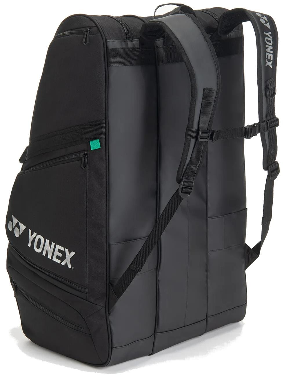 The Yonex BA726212EX Gearlogic 12 Racket Tennis Bag in black features two padded shoulder straps, side pockets, a white Yonex logo on the front pocket, multiple compartments, and a sleek modern design.