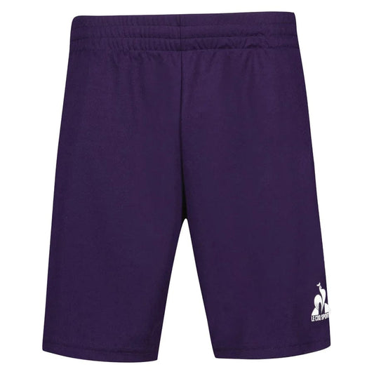 The Le Coq Sportif Pro Men's Tennis Shorts in Purple Velvet are crafted for optimal movement, featuring an elastic waistband. A stylized rooster logo accompanied by the "Le Coq Sportif" text is elegantly printed in white on the lower left side. Made from breathable material, these shorts are perfect for active pursuits.