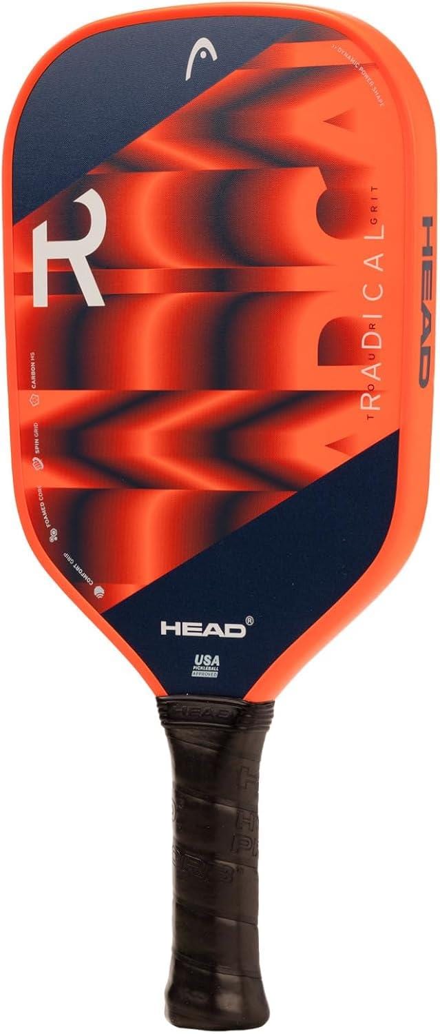 The HEAD Radical Tour Grit 2024 Pickleball Paddle features a red and navy blue design with bold geometric patterns, branding on the face, a black handle, and a durable graphite surface for dynamic play.