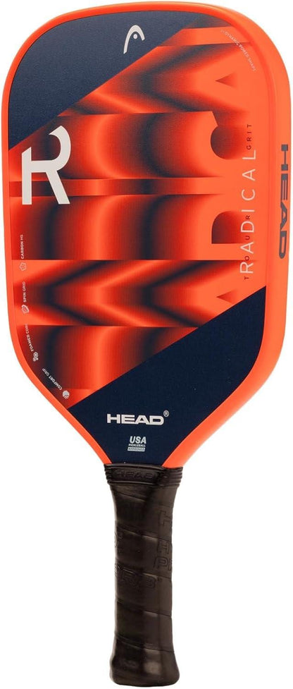 The HEAD Radical Tour Grit 2024 Pickleball Paddle features a red and navy blue design with bold geometric patterns, branding on the face, a black handle, and a durable graphite surface for dynamic play.