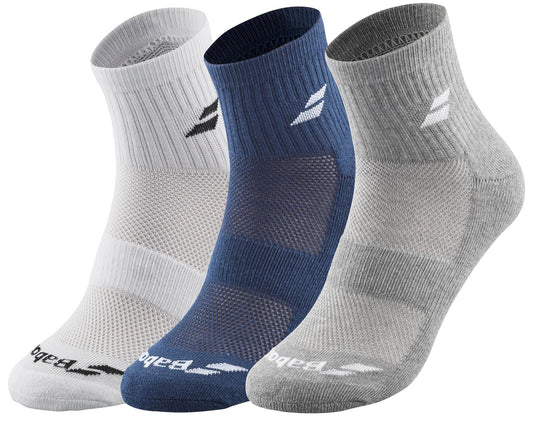 Displayed are three pairs of Babolat Quarter Tennis Socks. Available in white, blue, and gray, these socks are specifically designed for tennis with a logo near the top and ventilated zones around the foot area to enhance breathability and support.