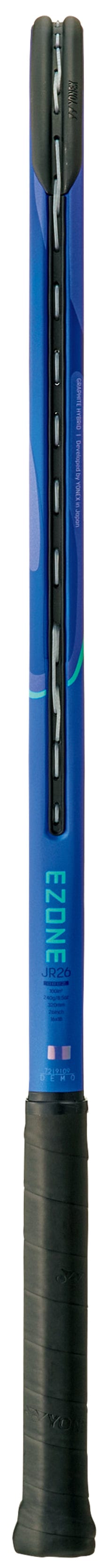 A close-up view of the Yonex EZONE 26 Junior Hybrid Blast Blue 2025 Tennis Racket, shown vertically with black grip tape on the handle and a focus on its hybrid graphite construction.