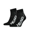 A pair from the HEAD Stripe Quarter Tennis Socks (2 Pack) in black, showcasing bold white "HEAD" lettering along the side. These socks offer cushioned soles and ribbed cuffs, featuring a mesh-like texture on top for breathability and added arch support for enhanced comfort.